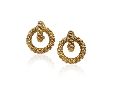 hermes gold earrings.